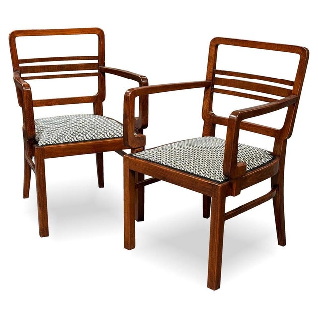 A pair of Art Deco armchairs dating from the 1930s, combining elegant geometric design with high-quality craftsmanship....
