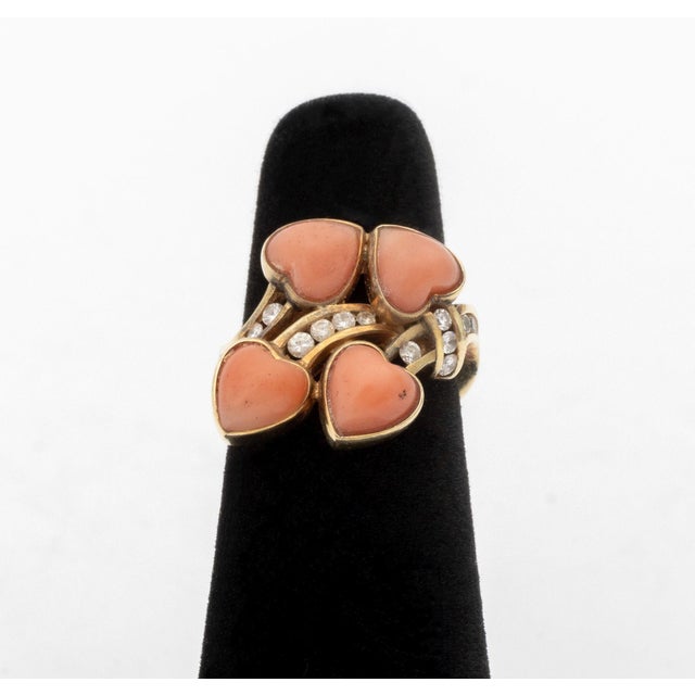 14K Yellow Gold Coral Diamond Ring, featuring four bezel set heart coral cabochons weighing a total of approx. 3.40...