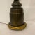 Fine turn-of-the-century French bronze electric lamp in the form of a cherub on a pedestal holding a Greek key scroll...