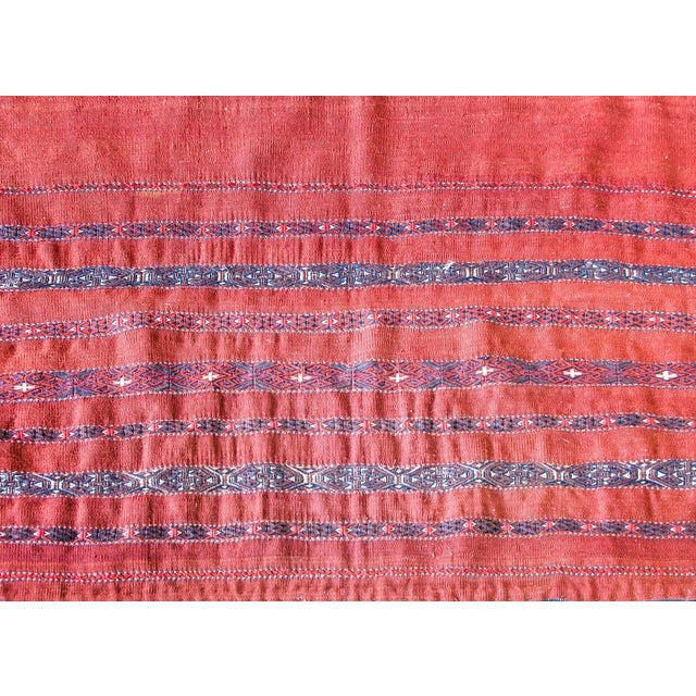A wonderful early 20th century Persian Turkman bag face rug with a simple crimson ground with tightly woven geometric...