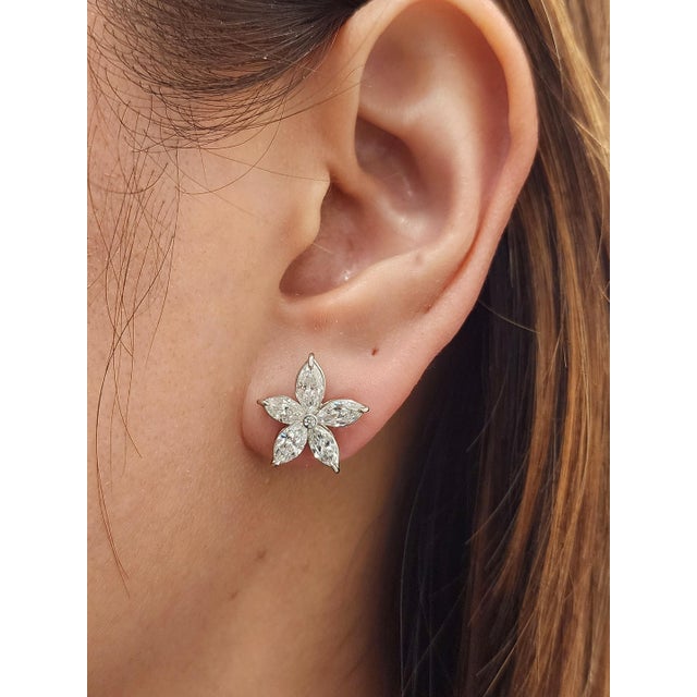 Exquisite stud earrings featuring 10 natural marquise-cut diamonds totaling 2.89 ct. Each diamond is set in platinum,...