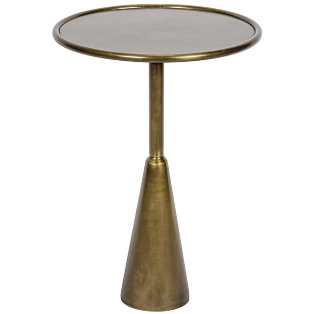 Restrained, almost severe lines create intrigue in this sleek side table. Handcrafted of minimally finished metal, not...