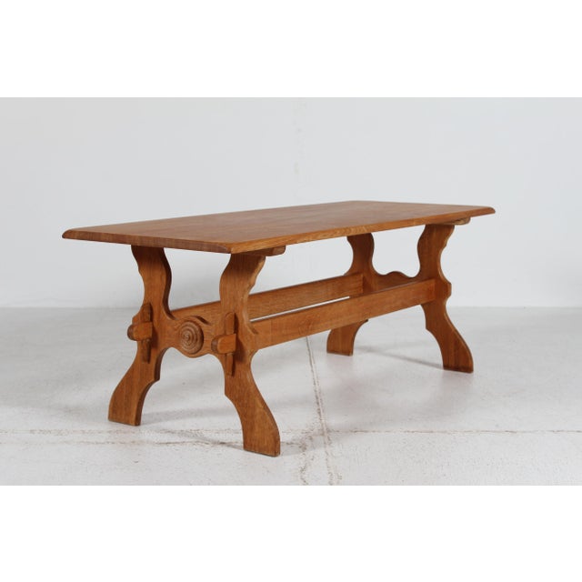 Danish brutalist style coffee table of solid oak with rosette wood work decoration. Handcrafted by a Danish cabinetmaker...