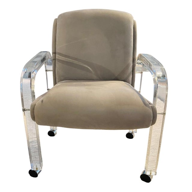 Lion in Frost Lucite Arm Chair (with casters) Dims: 25"W x 26"D x 32"H This Lucite armchair, characterized by a clear...