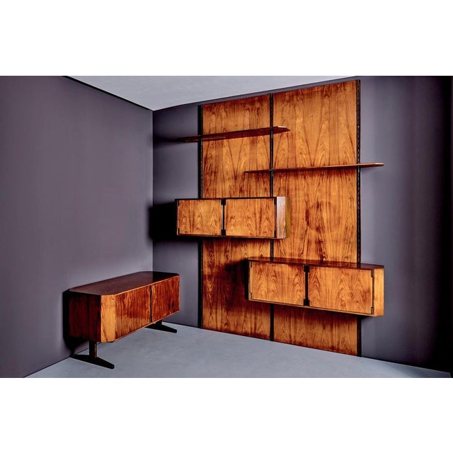Unique wall unit with matching credenza designed by Elio Monesi (1927–1994), created for his private home in Milan. The...