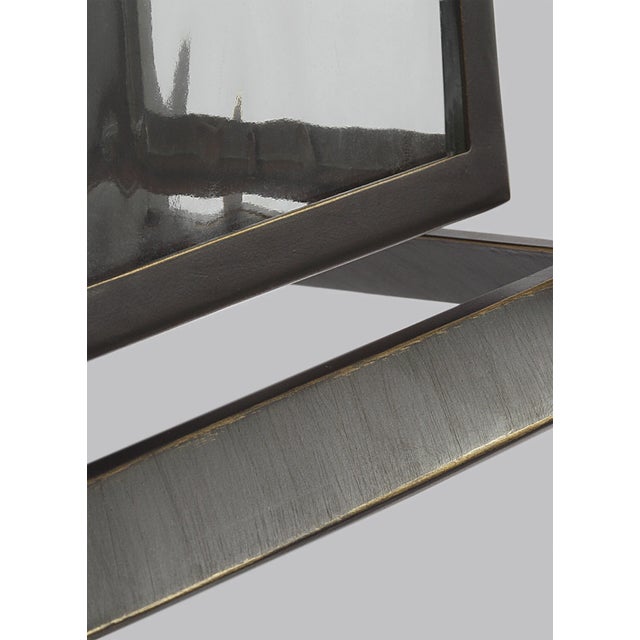 The Urbandale one light outdoor wall fixture in antique bronze creates a warm and inviting welcome presentation for your...