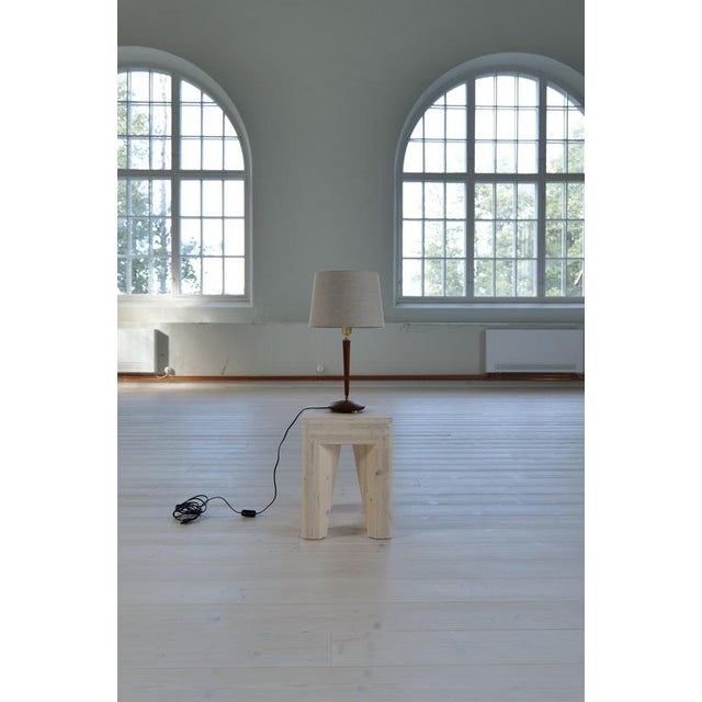 Wonderful sculptured table lamp produced in sweden at gothenburgs armaturhandverk. Details in teak and brass makes this...