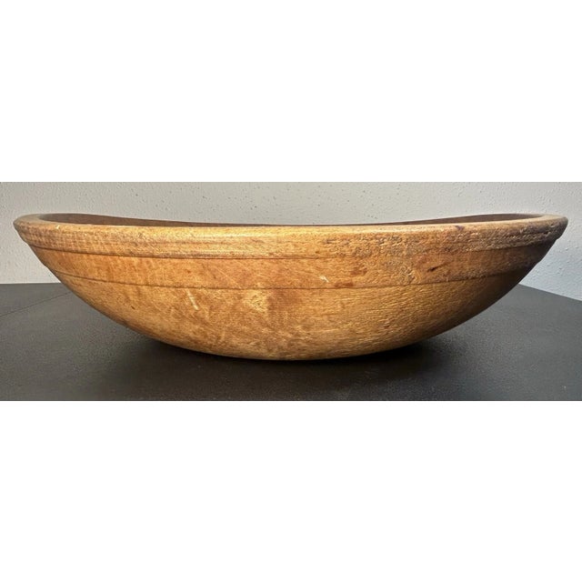 This is an Antique American Primitive Hand-Turned Maple Wood Out of Round Dough Bowl. It measures 3 3/4” tall and 15 1/8”...