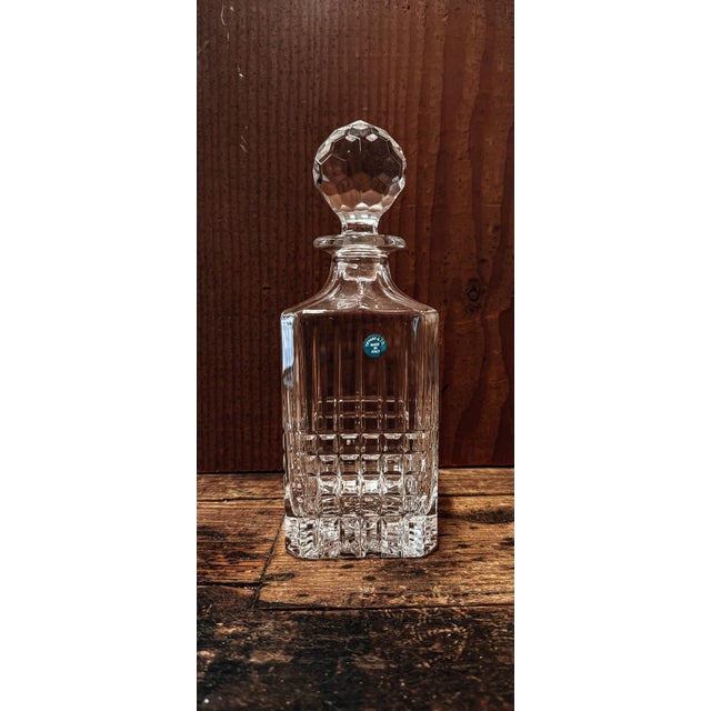 A Tiffany & Co crystal decanter with stopper in excellent condition from the retired Plaid collection.