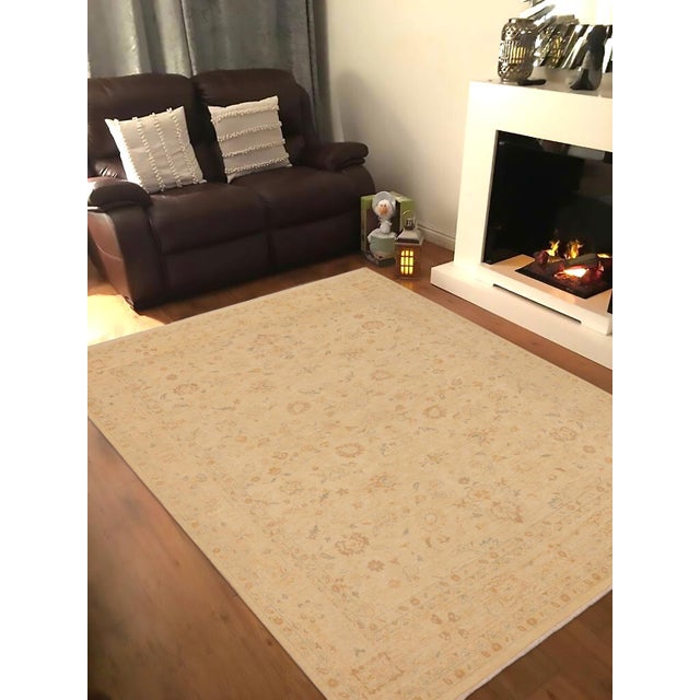 "Enhance the ambiance of your home with this magnificent Persian-influenced Turkish hand-knotted rug made by skilled...