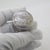 This vintage silver decorative object depicts a round pill snuff trinket box, crafted as a vanity table centerpiece, desk...