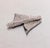 1960s rhodium plated textured draped cloth look brooch with security clasp. Marked "NAPIER©" on the back. Measures: 2 5/8...