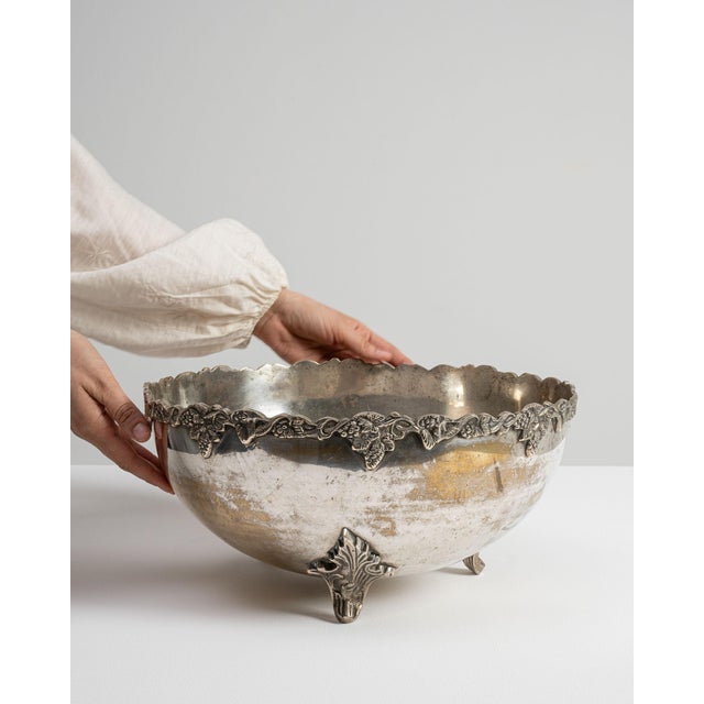 This early 20th century Baroque serving bowl from France is finished in silver. Its design carries the Baroque idiom...