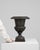 This piece presents as a urn, distinguished by dark bronze/black cast metal, fluted campana form. Originating in France...