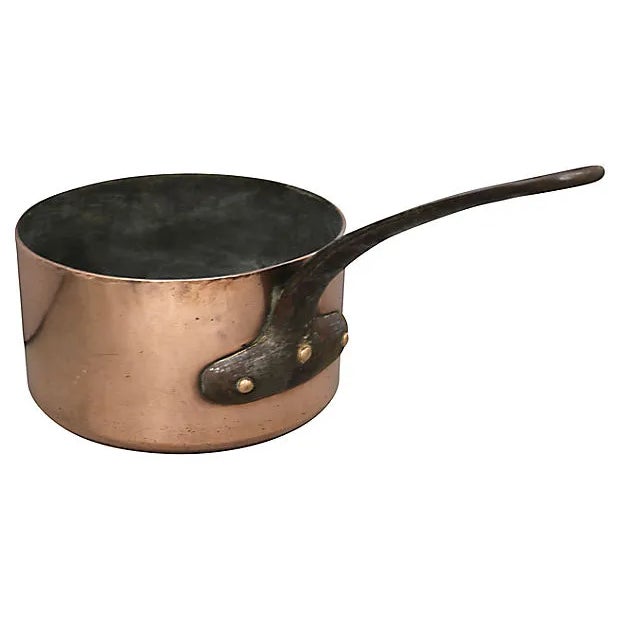 This charming antique English copper sauce pan features a distinctive "G D" monogram, adding a personal touch to its...