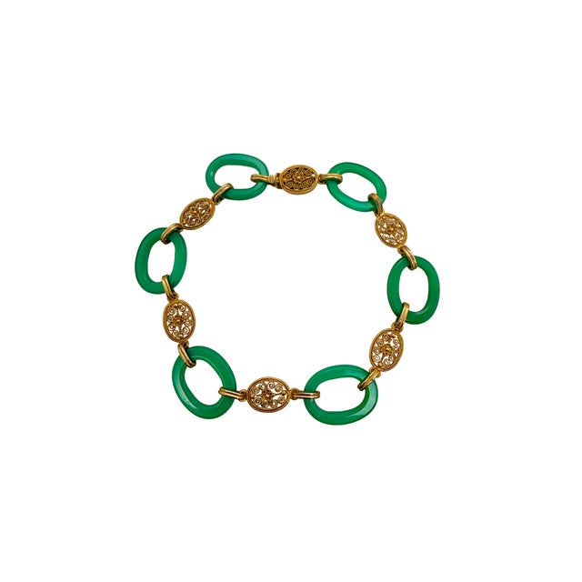 This is a fine Art Deco inspired bracelet that blends vivid color with elegant gold detailing. The bracelet is composed of...