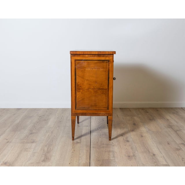 This refined Italian Louis XVI bedside table, crafted in the late 18th century, embodies the neoclassical ideals of...