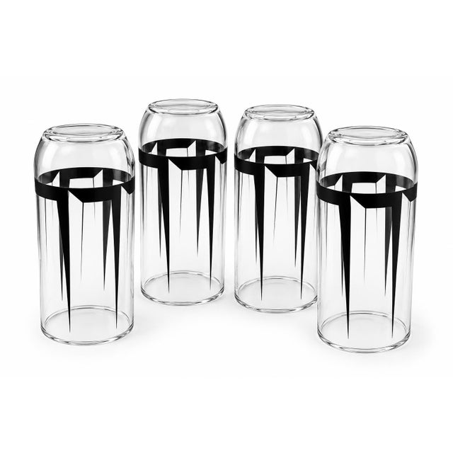 Striking vintage set of four clear glass highball tumblers featuring a bold black geometric pattern of sweeping bands and...
