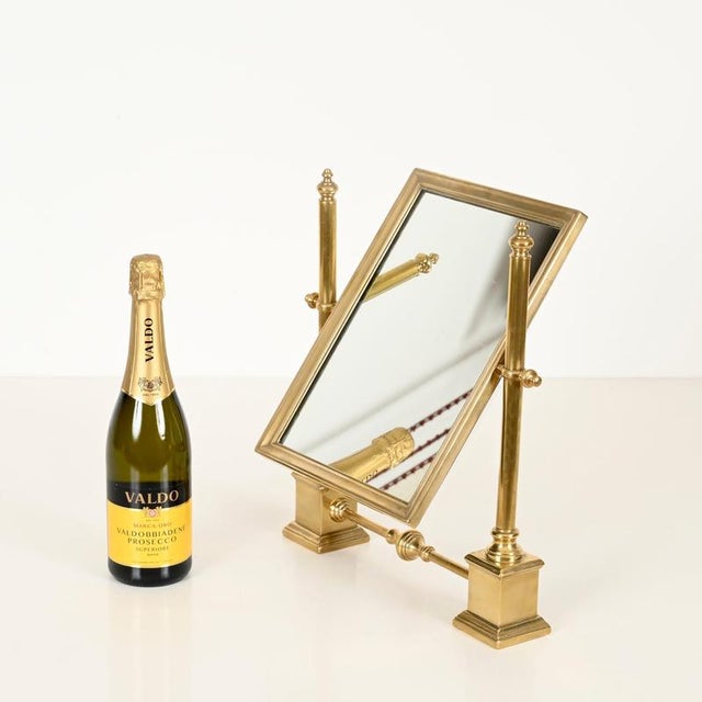 Elegant Italian Mid-Century adjustable table mirror entirely made in solid brass. This charming and unique piece was...
