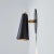 Pair of 'Lupita' sconces in black and brass by Alvaro Benitez. Hand-fabricated by Los Angeles based designer and lighting...