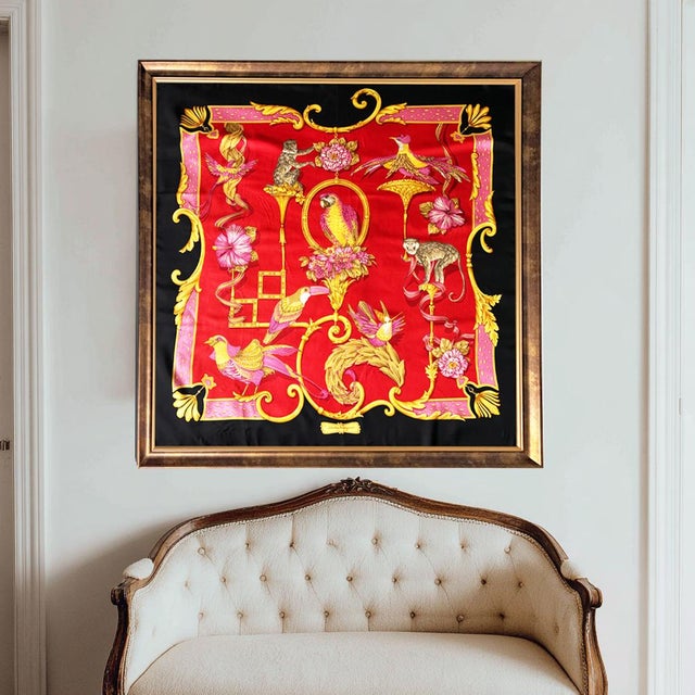 A magnificent and rare framed Salvatore Ferragamo silk scarf featuring an extraordinarily detailed composition of exotic...