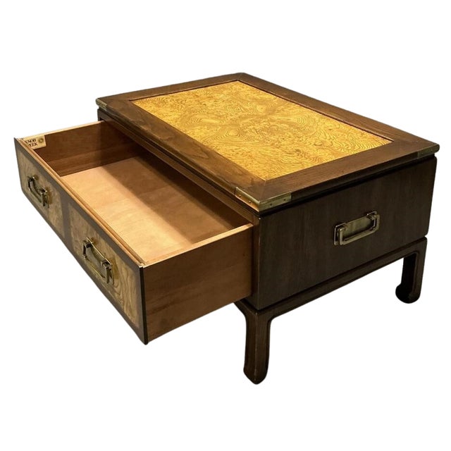 Vintage Knob Creek coffee or cocktail table featuring richly figured bookmatched burl veneer, walnut-toned framing, brass...
