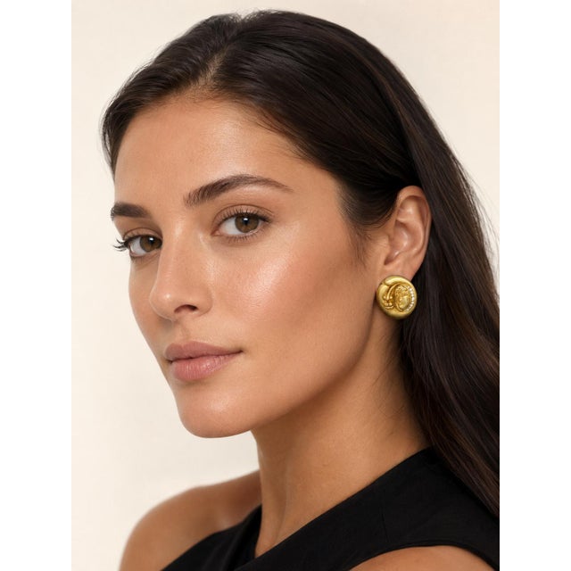 A bold and sculptural pair of 18 karat yellow gold earrings by Beverly Hills designer Vahe Naltchayan, dated 1994....
