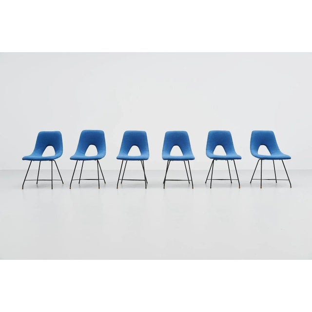 Highly rare set of 6 dining chairs designed by Augusto Bozzi and manufactured by Saporiti, Italy 1954. These chairs have a...