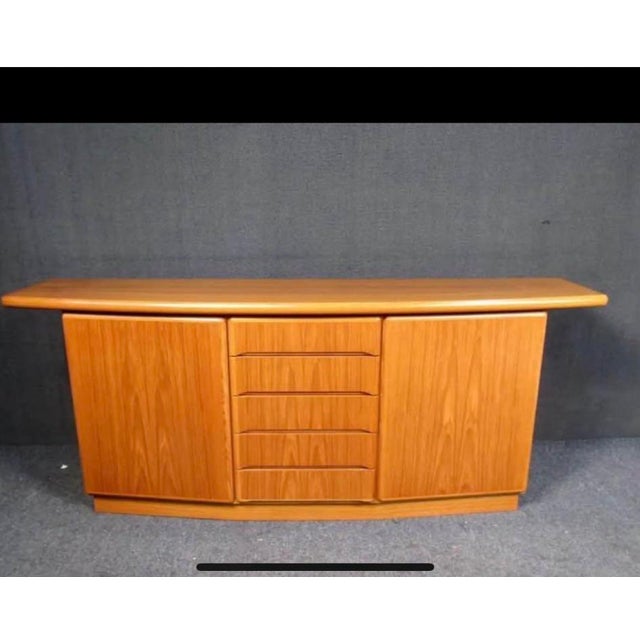 This beautiful teak credenza has a beautiful smooth finish with five main drawers and two storage areas to the right and...
