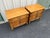 A set of two vintage fruitwood nightstands in a neoclassical style. Light coloring and complex burlwood grain patterns on...