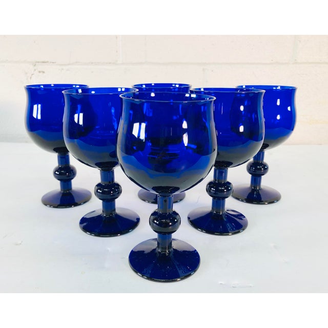 Art Deco style set of 6 cobalt glass wine stems with a ball accented stem. No marks. Excellent condition.