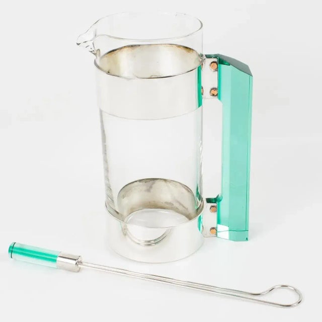 A stylish barware set designed by Italian Rede Guzzini from the 1970s. This set includes a Martini cocktail pitcher and...