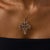 This extraordinary Edwardian pendant necklace is a richly detailed jewel from the 1910’s, centered by an antique pear...