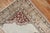 mid 20th century one of a kind Turkish Rug depicting a large lion and small bird on a white field and silver floral...