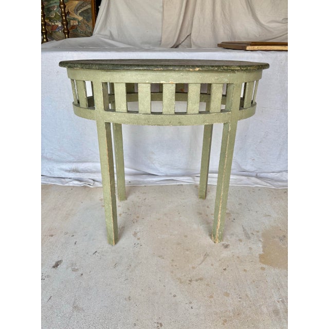Found in the South of France, this Early 20th Century French Patinated Side Table was crafted from old growth pine in the...
