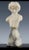 A charming hand-carved alabaster bust of a child circa 1920. Sweet features and attached to it's original marble base....