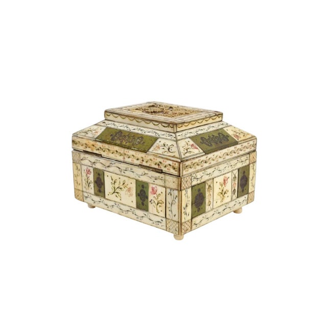 An exceptional circa 1860 Russian decorative box crafted in carved bone and richly embellished with stained green bone...