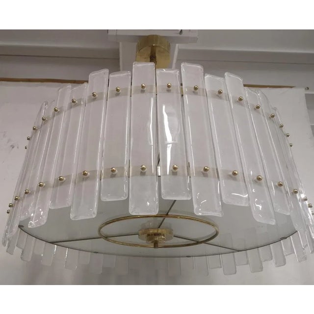 Superb chandelier / ceiling light of amazing sand blasted color; a perfect round loaded with sandblasted glass plates. Its...