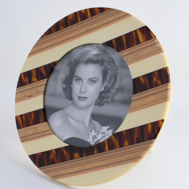 This spectacular modernist picture frame was crafted in Italy circa 1970. The rare photo frame features a rounded shape...