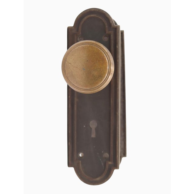 Classic style door knob set with brass knobs and back plates. The original mounting screws are not available. Priced as...
