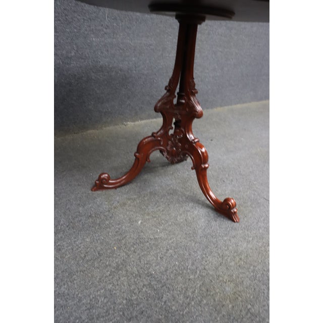 Hickory Chair side table from the Mount Vernon Collection, featuring a carved pie-crust edge, shaped oval top, and...