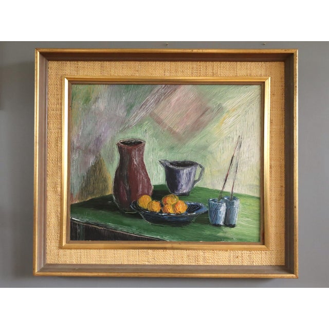 FRUIT & BRUSHES Size: 20.3 x 23.4 inches (including frame) Oil on board A painterly and expressive mid-century still life...