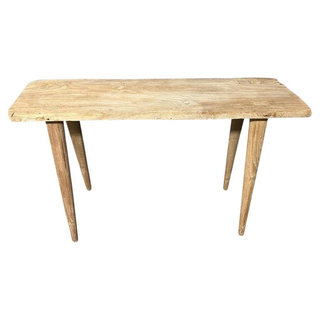 A single thick antique teak panel with lovely character within the wood. We added smooth teak minimalist legs and a...