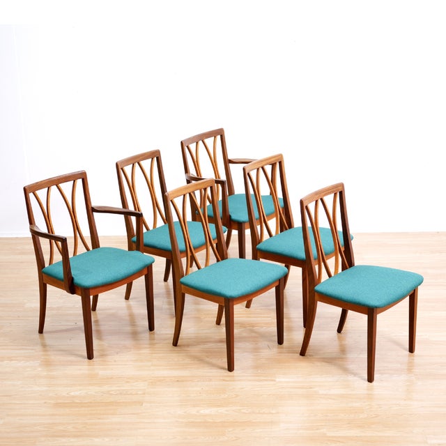 This stunning set of six dining chairs were designed by G Plan during the 1970s. Produced in afromosia with teal freshly...