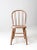 This charming vintage bow-back Windsor chair features a beautifully weathered farmhouse finish in a soft pinkish-beige,...