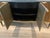 Malibu Crest by AICO Furniture Crotch Mahogany finish 4 Cabinet doors with champagne finished trims Pullout silverware...