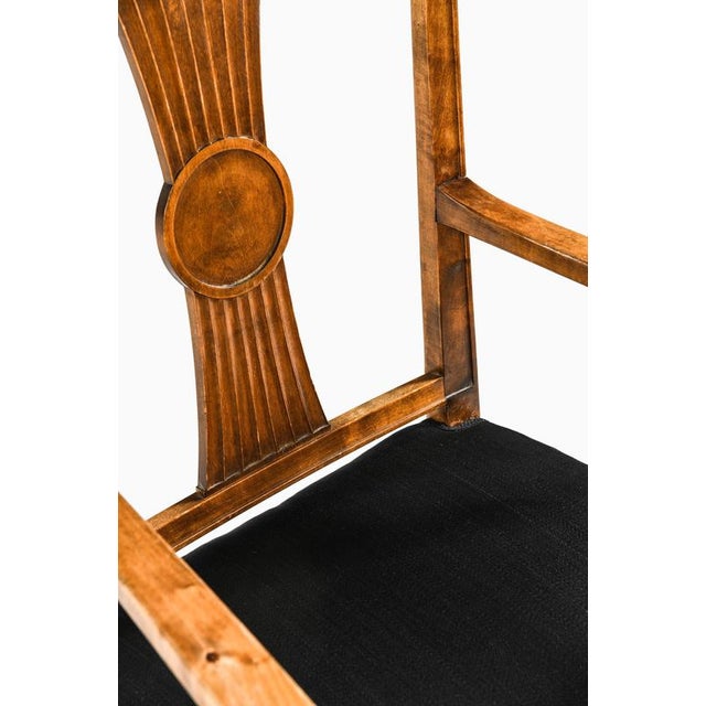 This armchair, attributed to axel einar hjorth and produced by bodafors in sweden during the 1930s, represents a refined...