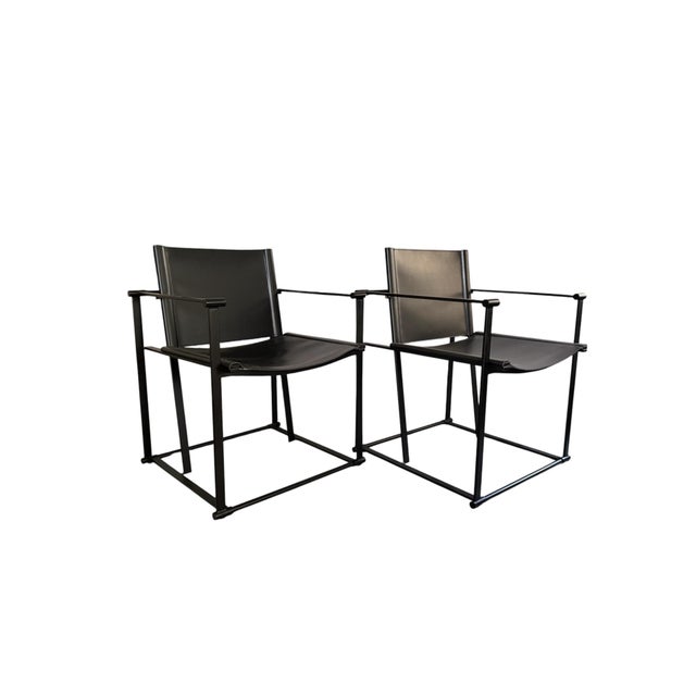 Striking pair of cube chairs in the style of Radboud van Beekum. Minimalist black metal cube frame with black PU leather...