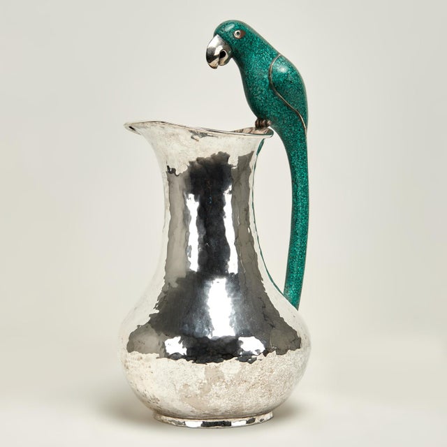 Impressive large vintage pitcher handcrafted in silver plate on hammered copper in modern form featuring a life size stone...