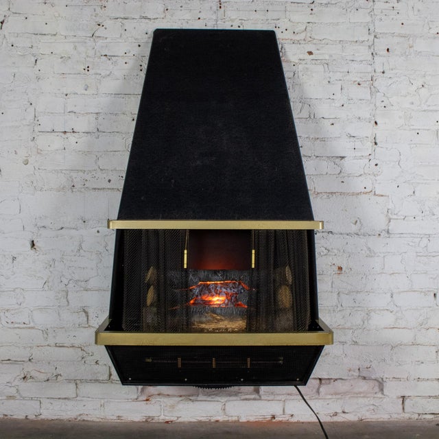 Handsome vintage MCM or Mid-Century Modern to Modern electric fireplace by Arvin Industries composed of a black texture...